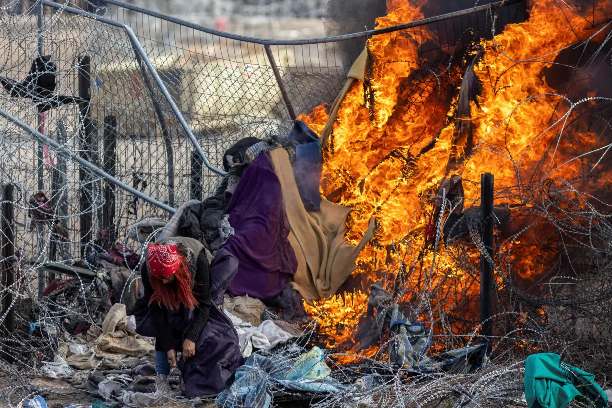 Migrants cross into the U.S. as seen from Ciudad Juarez