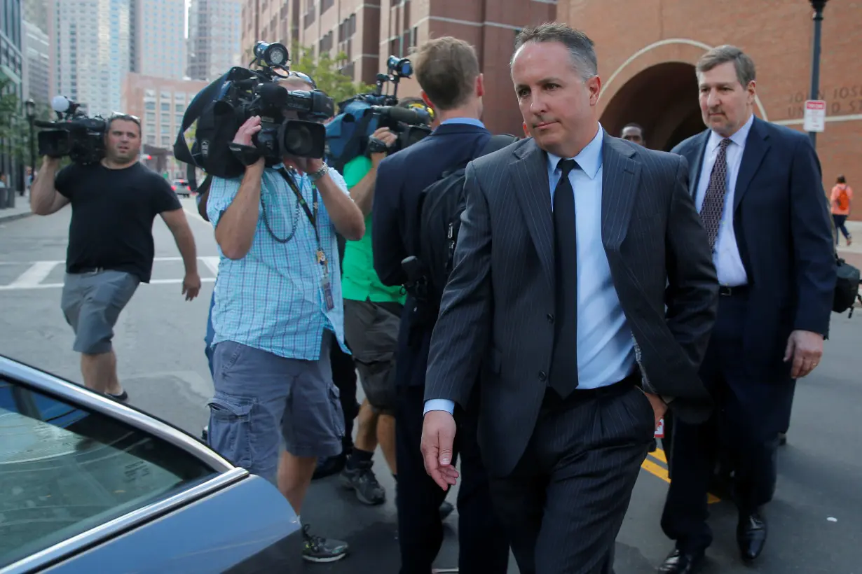 Pharmacist and co-founder of the now-defunct New England Compounding Center Cadden walks to his car after being sentenced to in jail in Boston