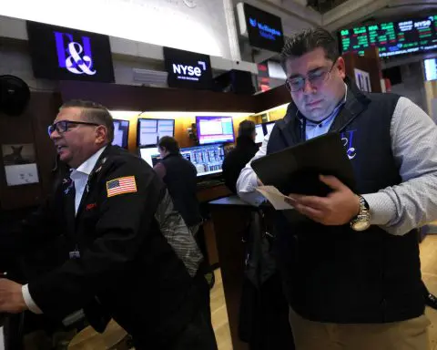 Futures tick up after Wall Street hits record highs