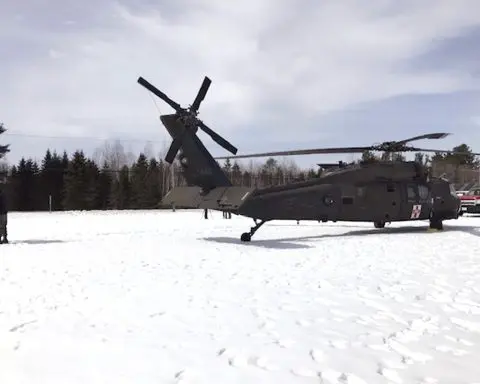 A man who crashed a snowmobile into a parked Black Hawk helicopter is suing the government for $9.5M