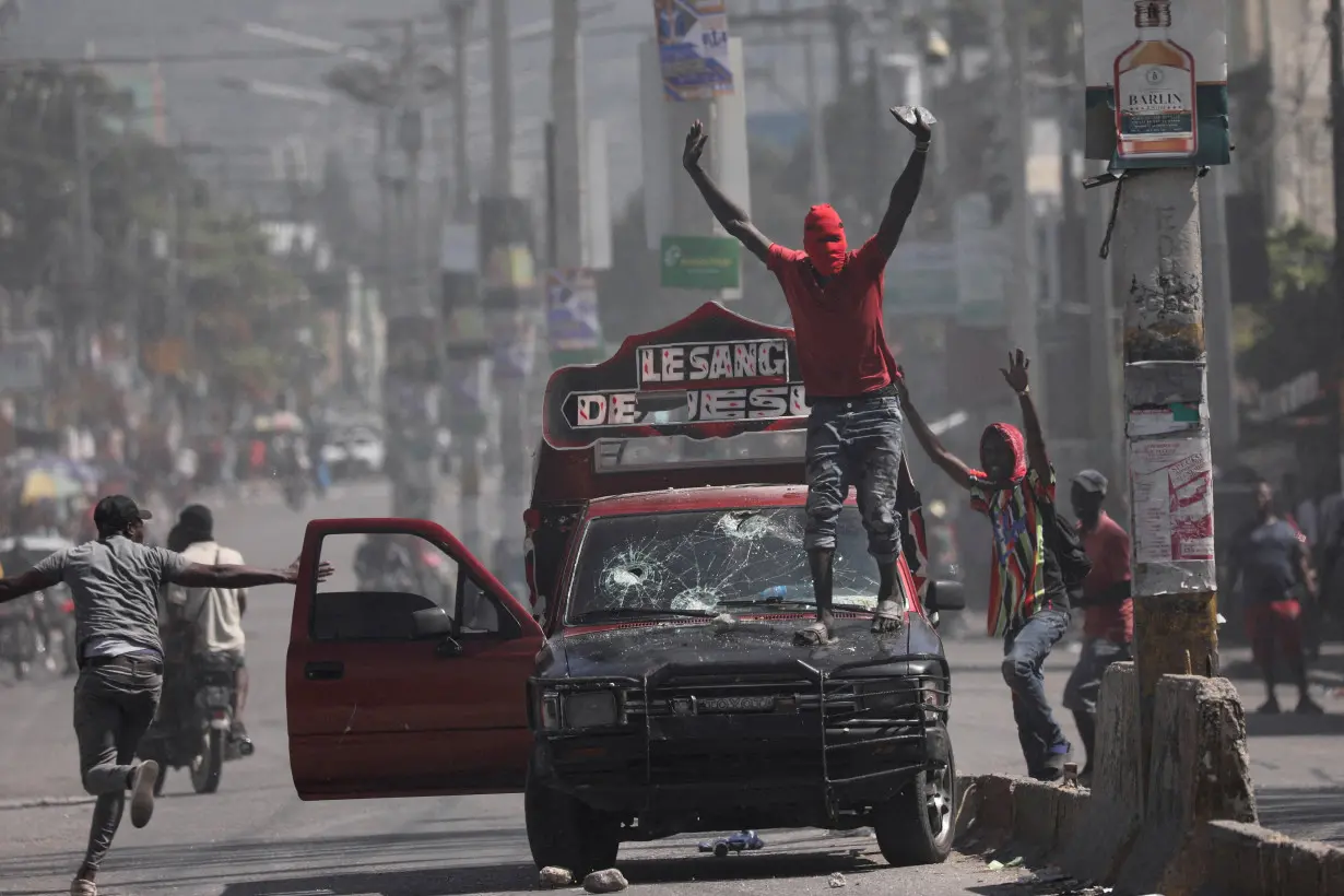 FILE PHOTO: People demonstrate against the government and insecurity in Port-au-Prince