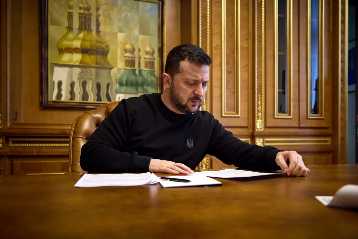 FILE PHOTO: Ukraine's President Zelenskiy speaks with U.S. House Speaker Johnson via phone line in Kyiv