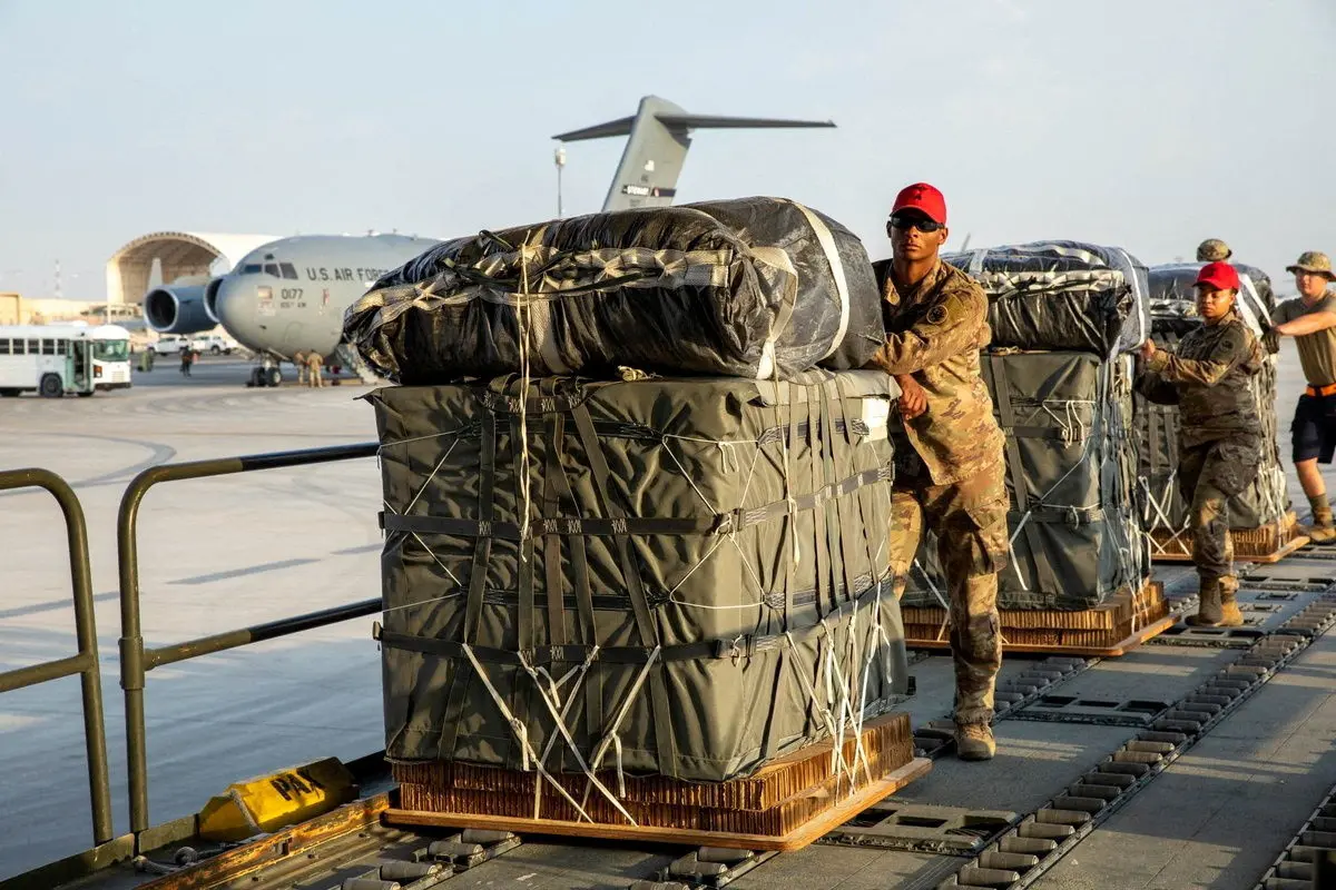 FILE PHOTO: U.S. Air Force members work on the preparation of a humanitarian aid drop for Gaza residents