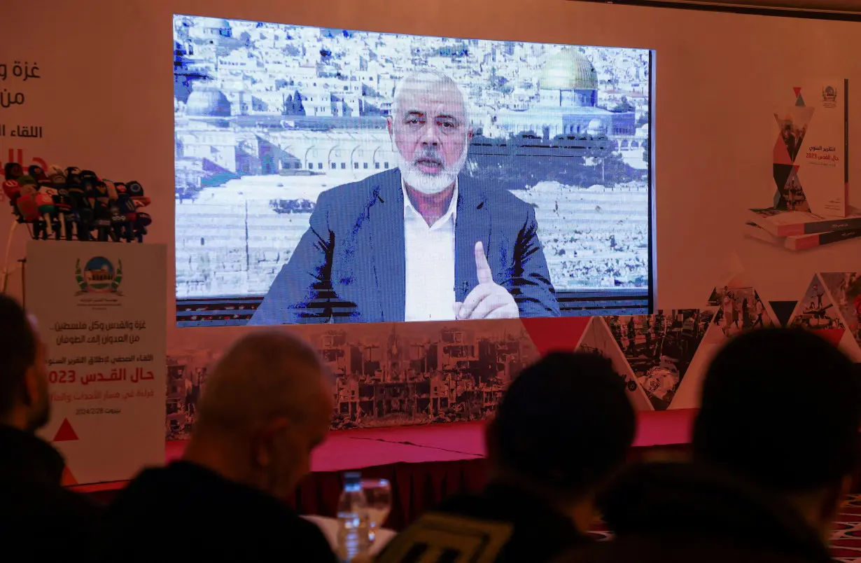 FILE PHOTO: Hamas leader, Ismail Haniyeh, speaks in a pre-recorded message shown on a screen during a press event for Al Quds International Institution in Beirut
