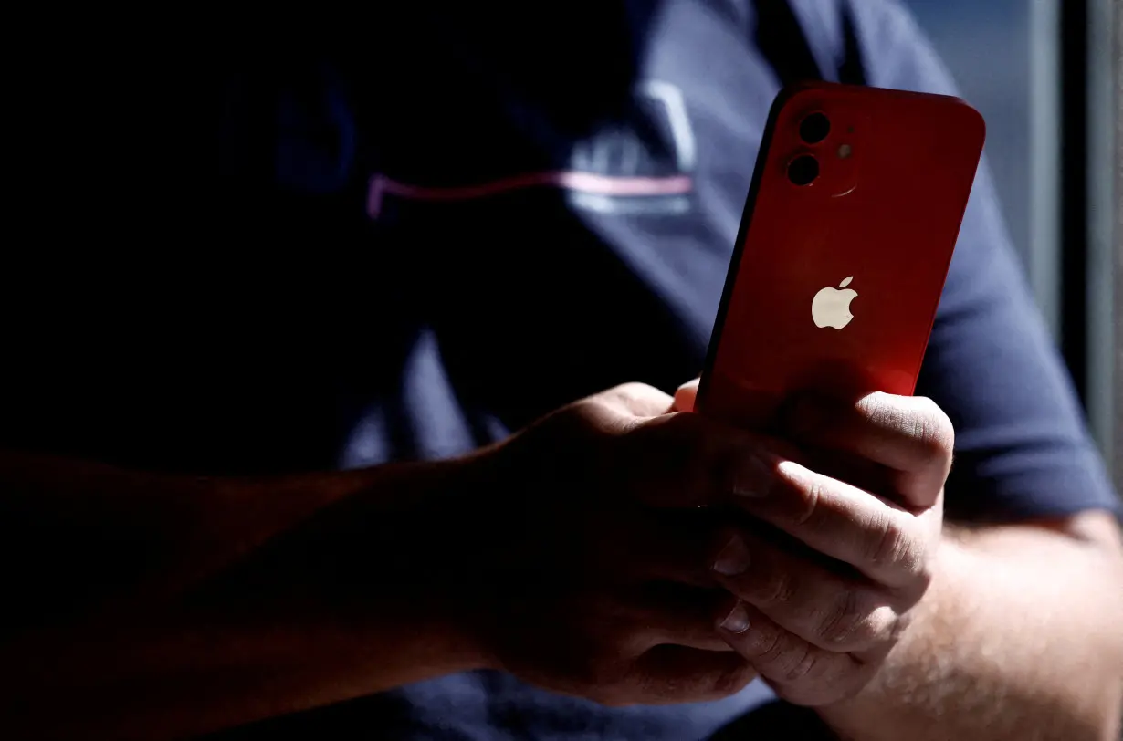 FILE PHOTO: An Apple iPhone 12 in a mobile phone store in Nantes