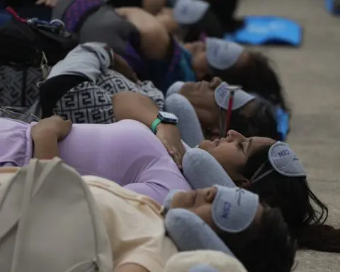 Hundreds of people in Mexico City stretch out for a 'mass nap' to commemorate World Sleep Day