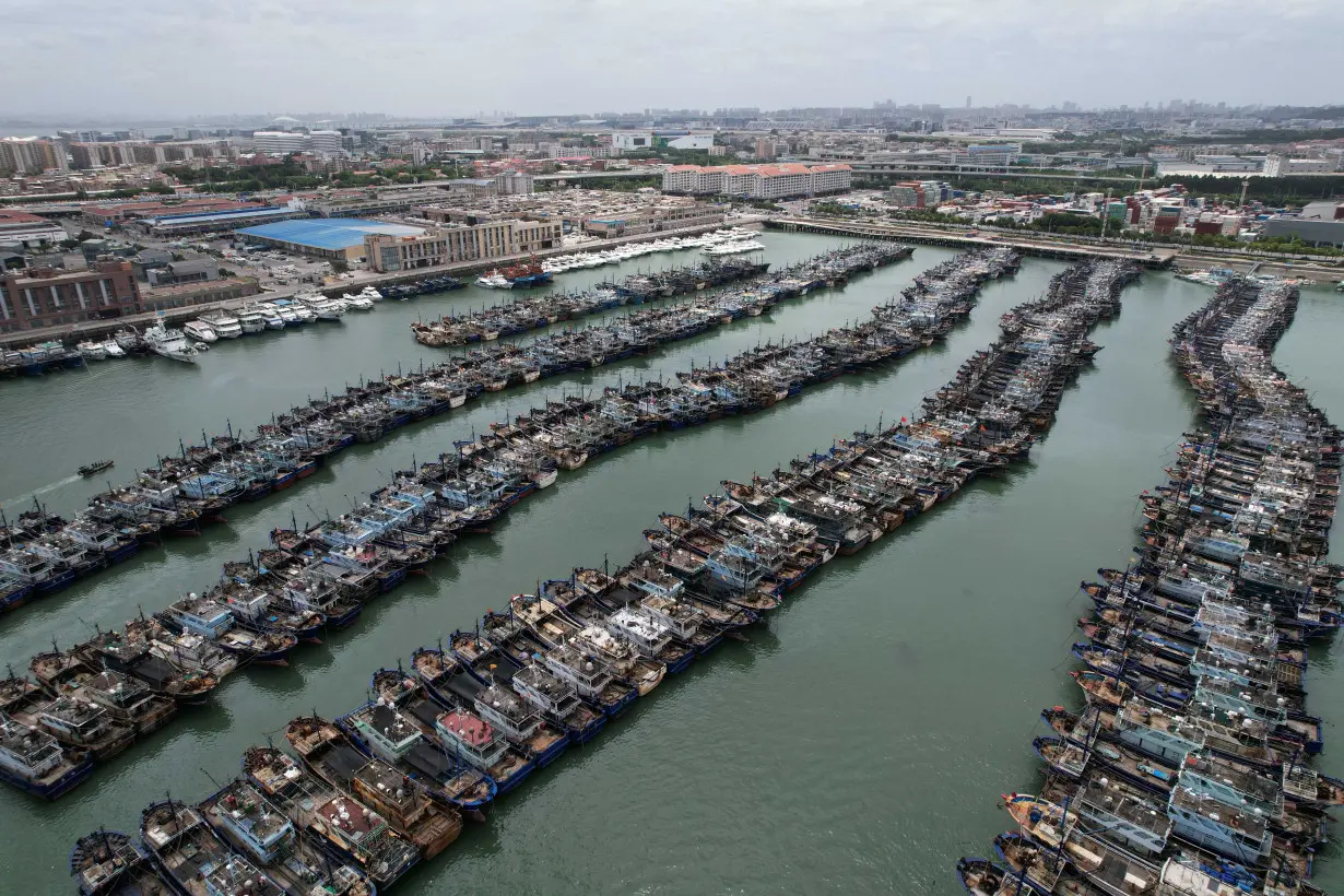 Fishing boats at a port as typhoon Doksuri approaches, in Xiamen