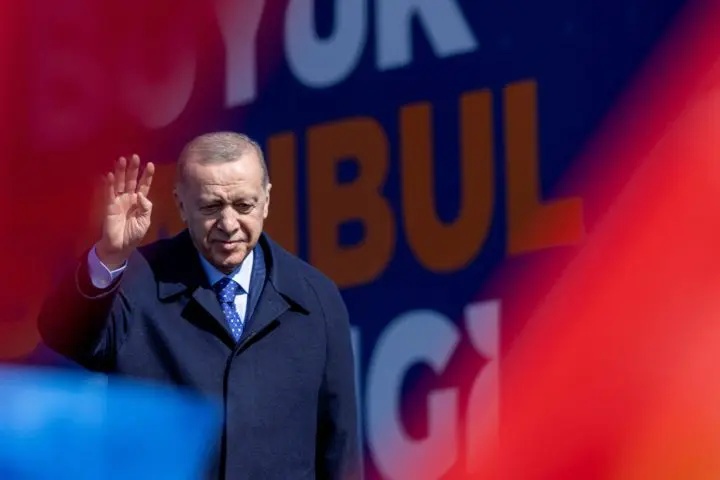 Turkey's President Tayyip Erdogan greets his supporters during a rally ahead of the local elections in Istanbul