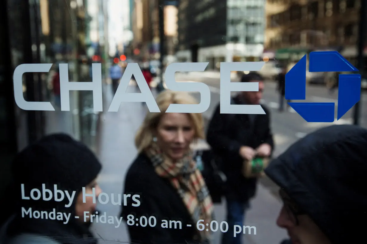 FILE PHOTO: A customer walks out of a branch of the JPMorgan Chase & Co bank in New York