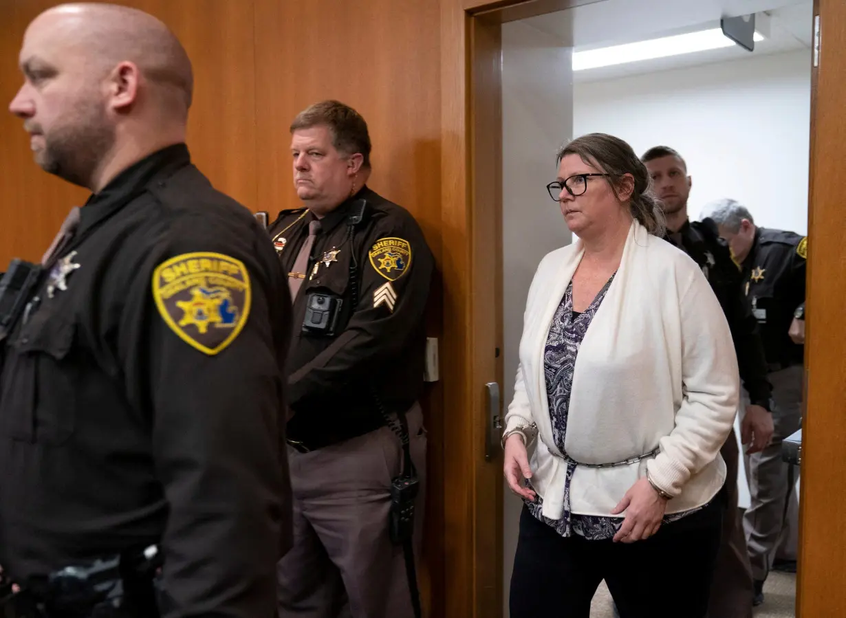 Jennifer Crumbley, the mother of Oxford High School shooter Ethan Crumbley, enters the court to hear the verdict just before the jury found her guilty