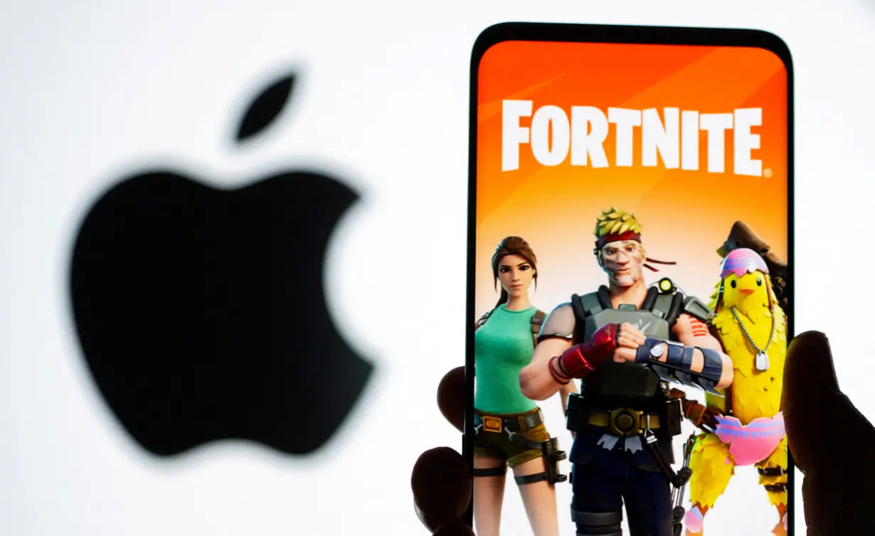 FILE PHOTO: Fortnite graphic and Apple logo displayed in illustration