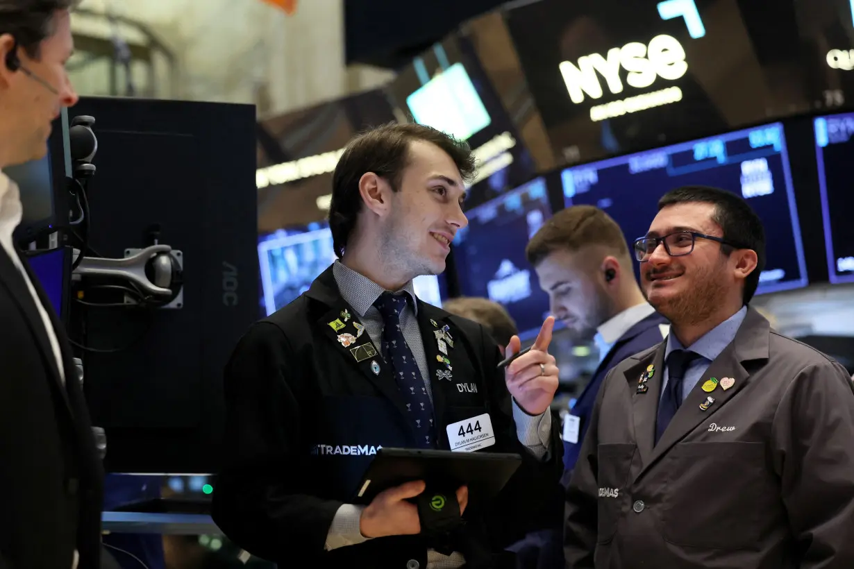 Traders work on the floor of the NYSE in New York