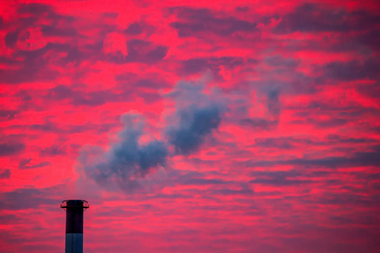 FILE PHOTO: Steam rises from a smoke stack at sunset in Lansing, Michigan