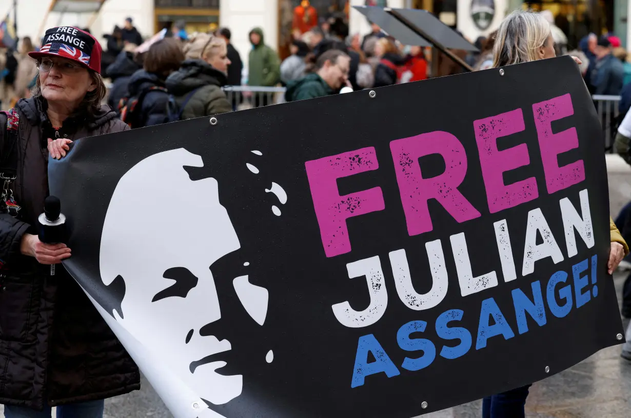 FILE PHOTO: Supporters of WikiLeaks founder Julian Assange protest in Vienna