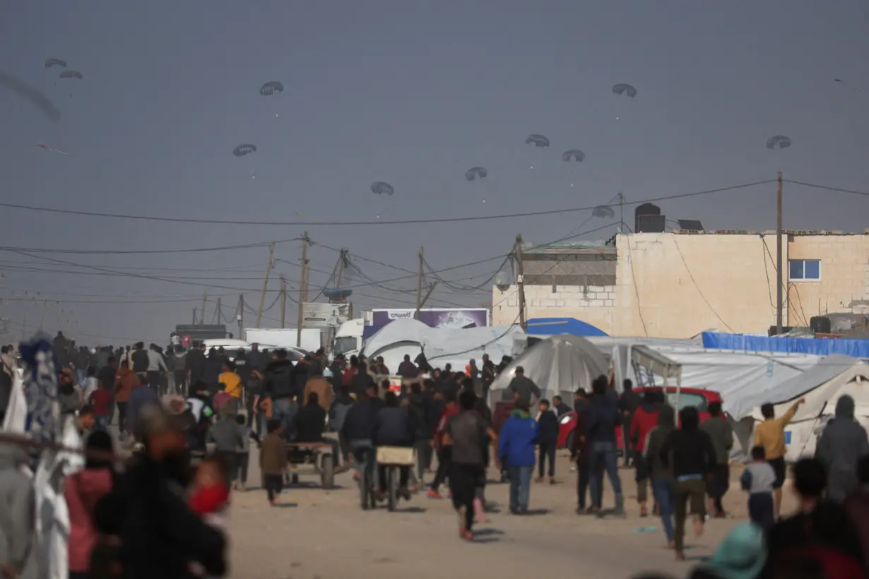 Aid is air-dropped over Gaza, amid the ongoing the conflict between Israel and Hamas, in Rafah