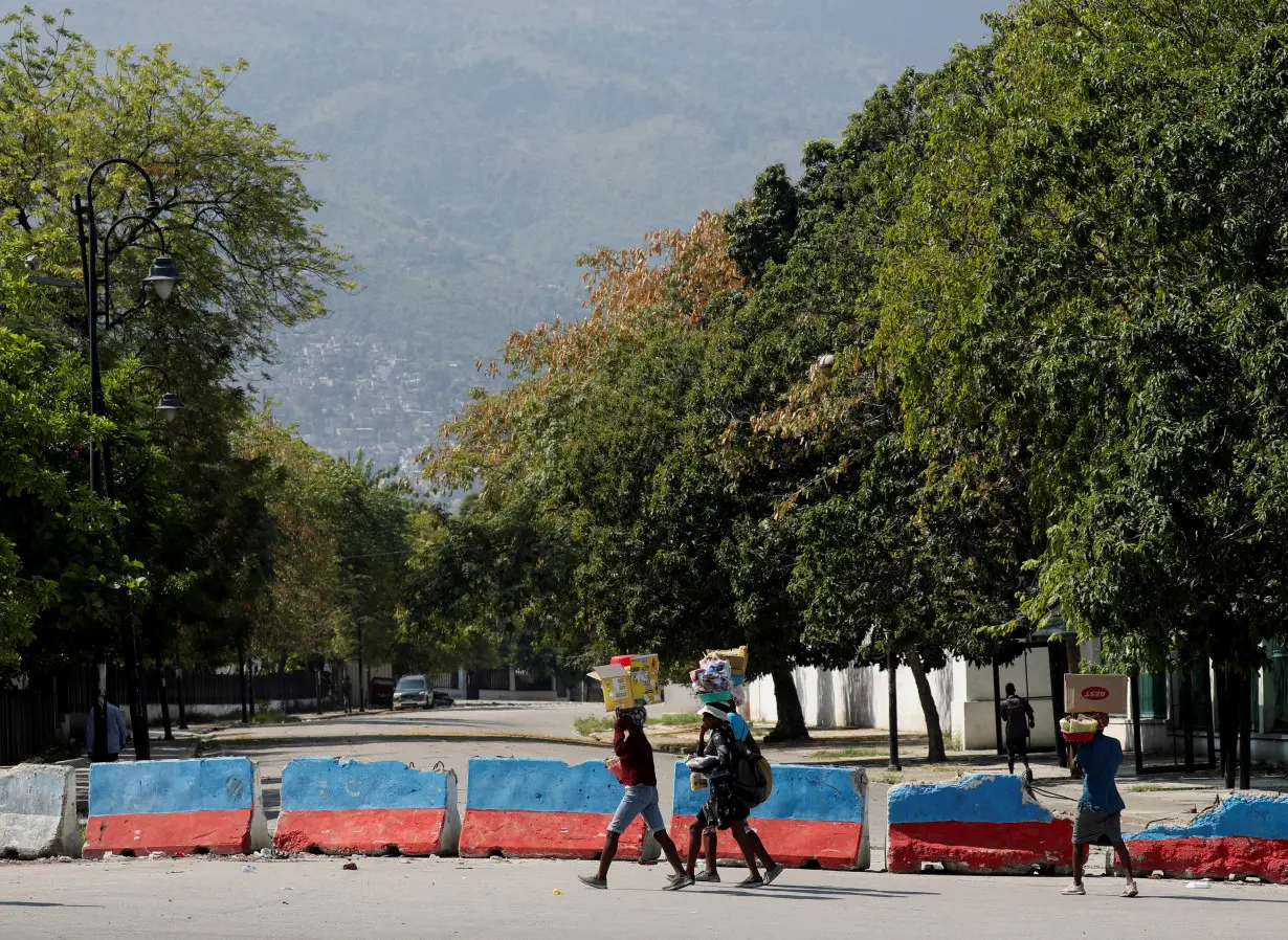 FILE PHOTO: After prime minister pledges to step down, uneasy quiet in Haiti capital