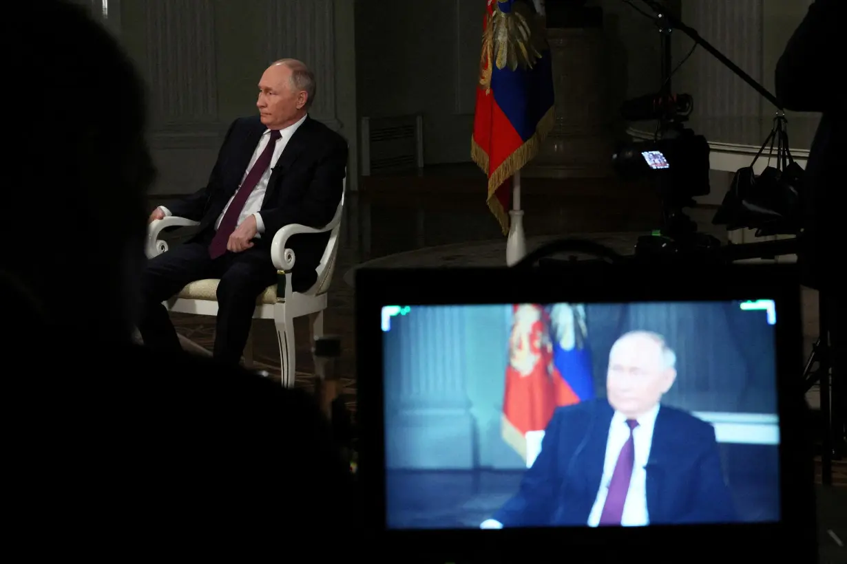 FILE PHOTO: Russian President Vladimir Putin gives interview to U.S. television host Tucker Carlson in Moscow