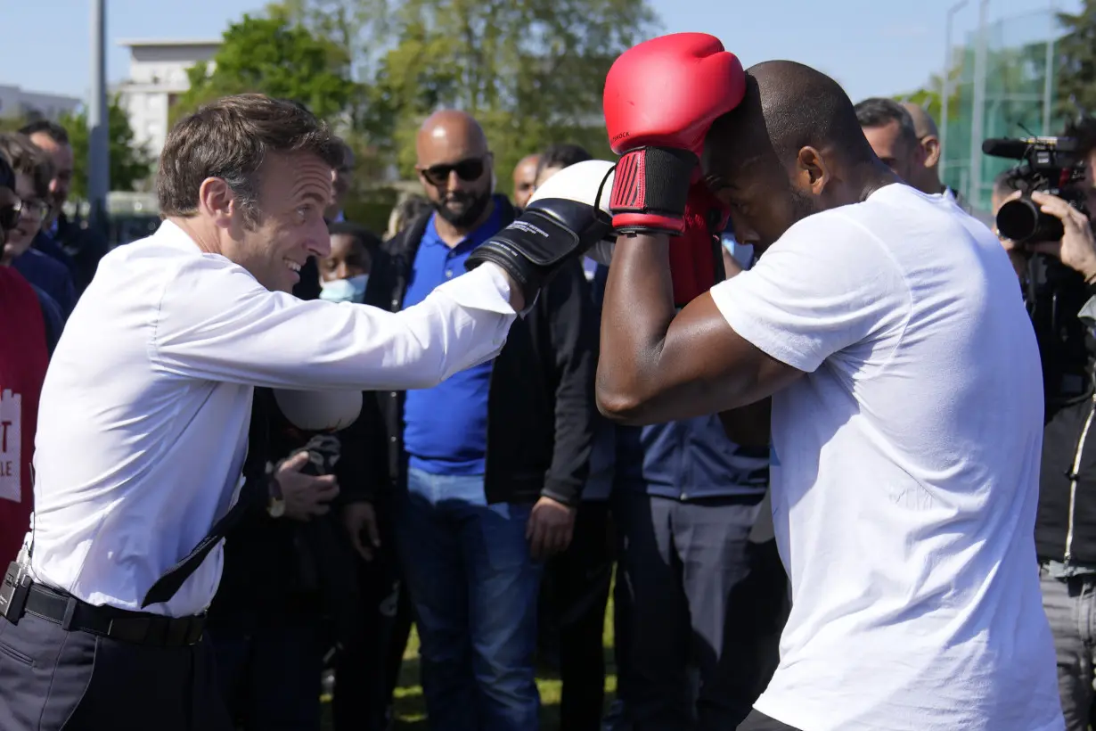 France's president pounds a punching bag on camera, and Europe notices