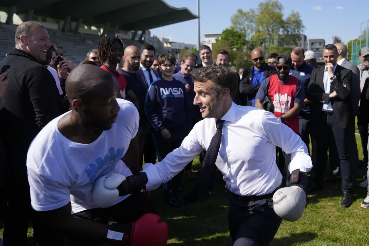 France's president pounds a punching bag on camera, and Europe notices