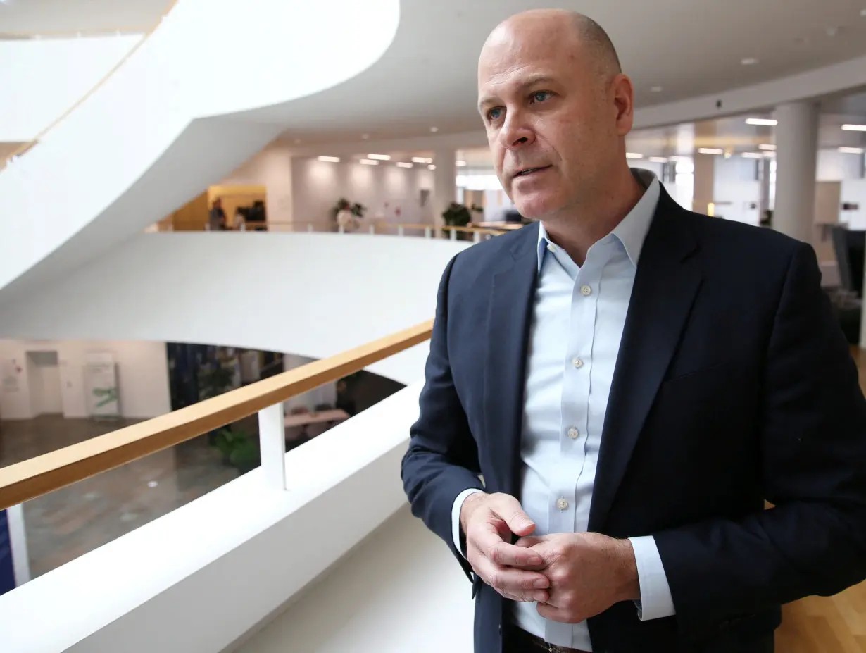 Novo Nordisk’s Executive Vice President, Corporate Development, David Moore talks to a journalist in Copenhagen