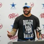 Cowboys rework Dak Prescott's contract to reduce massive cap hit slightly, AP source says