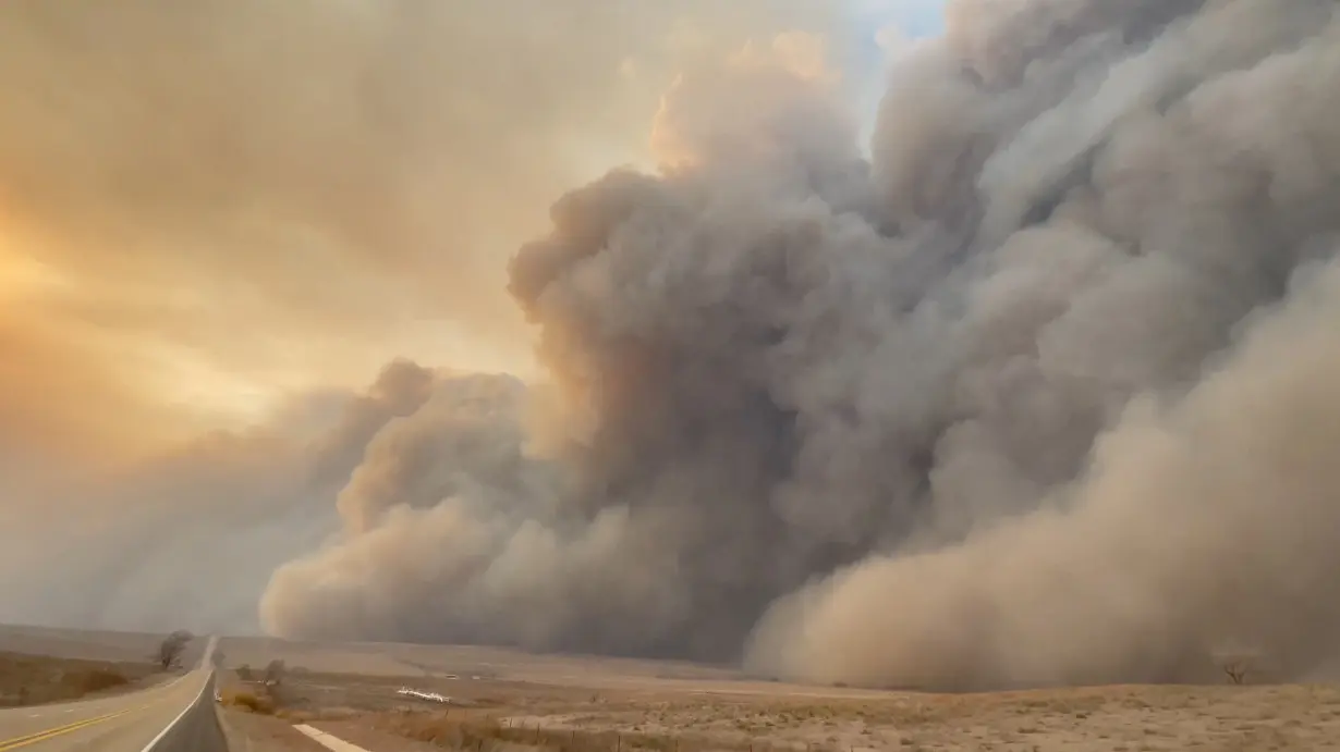 Smoke rises from a wildfire in Texas