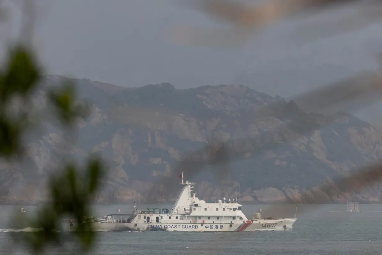 FILE PHOTO: FILE PHOTO: A Chinese coastguard ship sails during a military drill near Fuzhou, Fujian Province, near the Taiwan-controlled Matsu Islands