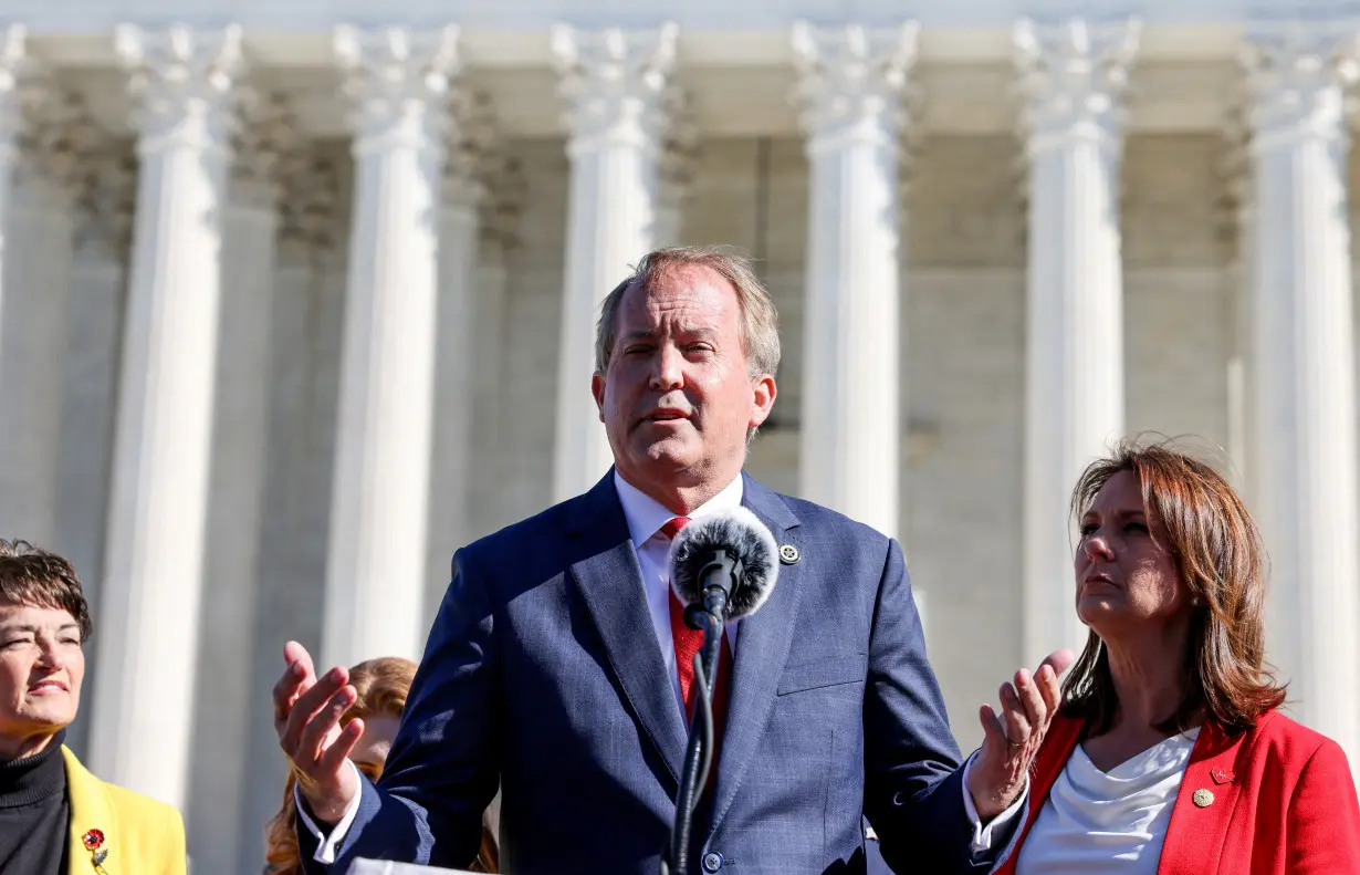 FILE PHOTO: Texas Attorney General Ken Paxton speaks to anti-abortion activists outside the U.S. Supreme Court, in Washington