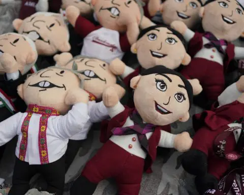 Hats, T-shirts and dolls reflect outgoing Mexican president's outsized presence in upcoming election