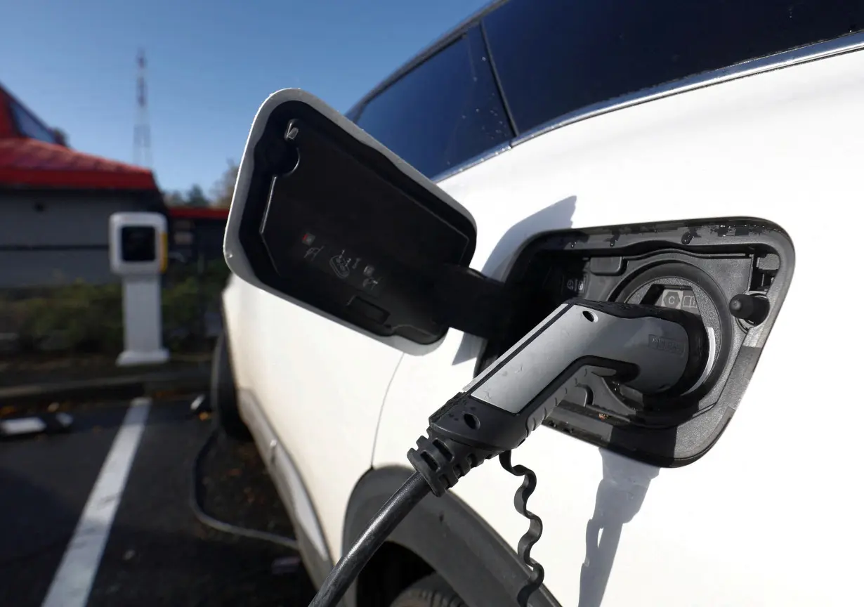 FILE PHOTO: An Audi electric vehicle is being charged in a charging station in Drogenbos