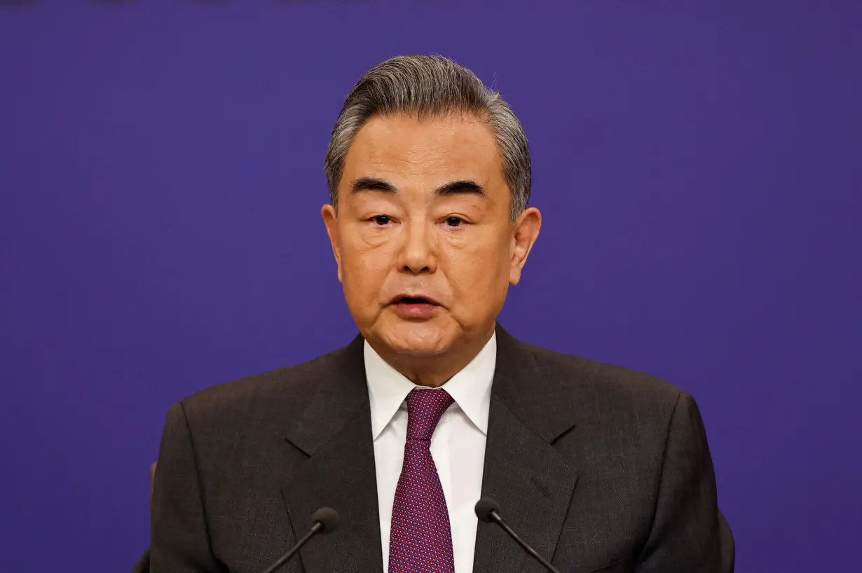 Chinese Foreign Minister Wang Yi attends a press conference on the sidelines of the NPC, in Beijing