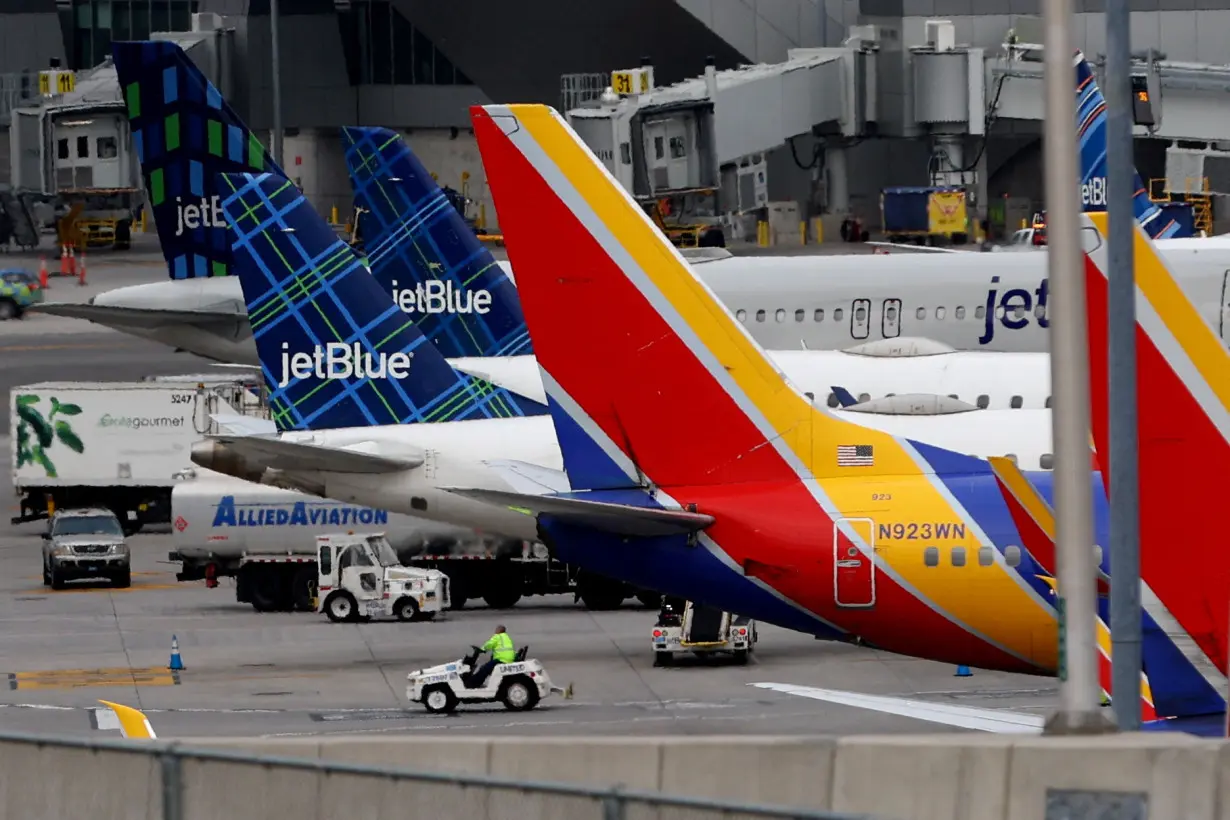 FILE PHOTO: Planes after flights were grounded due to an FAA system outage at Laguardia Airport in New York