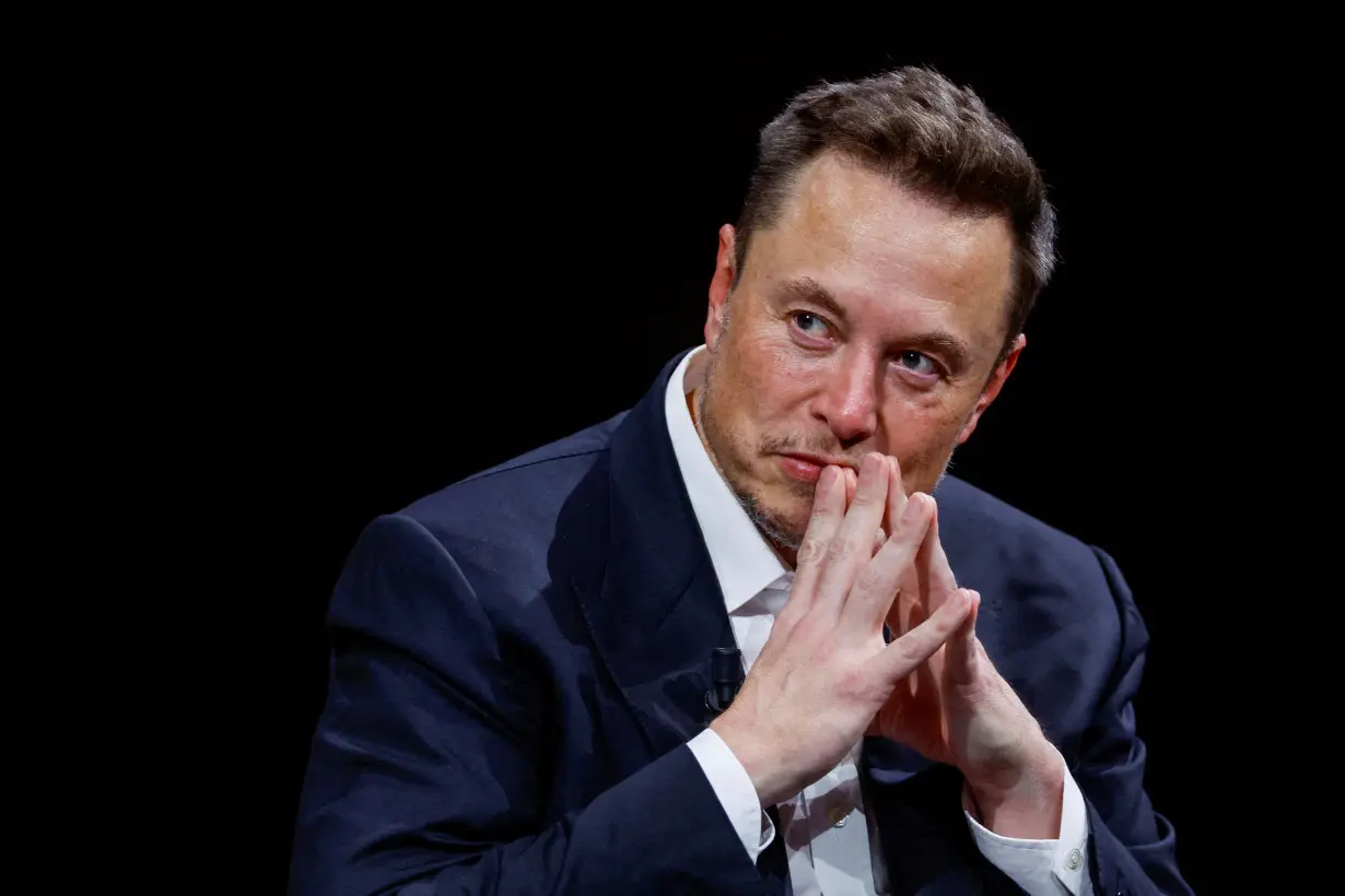 FILE PHOTO: Tesla CEO and Twitter owner Elon Musk attends the VivaTech conference in Paris