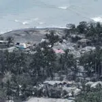 Indonesia's Mount Ruang erupts again, spewing ash and peppering villages with debris