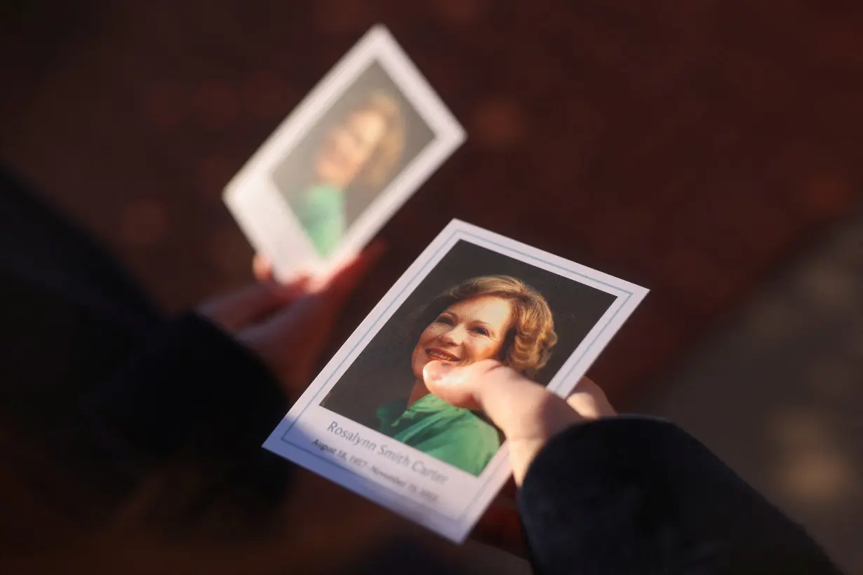 The funeral procession for former U.S. first lady Rosalynn Carter passes through downtown Plains