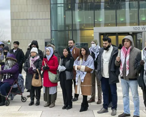 Vigil held to honor slain Muslim boy as accused attacker appears in court in Illinois