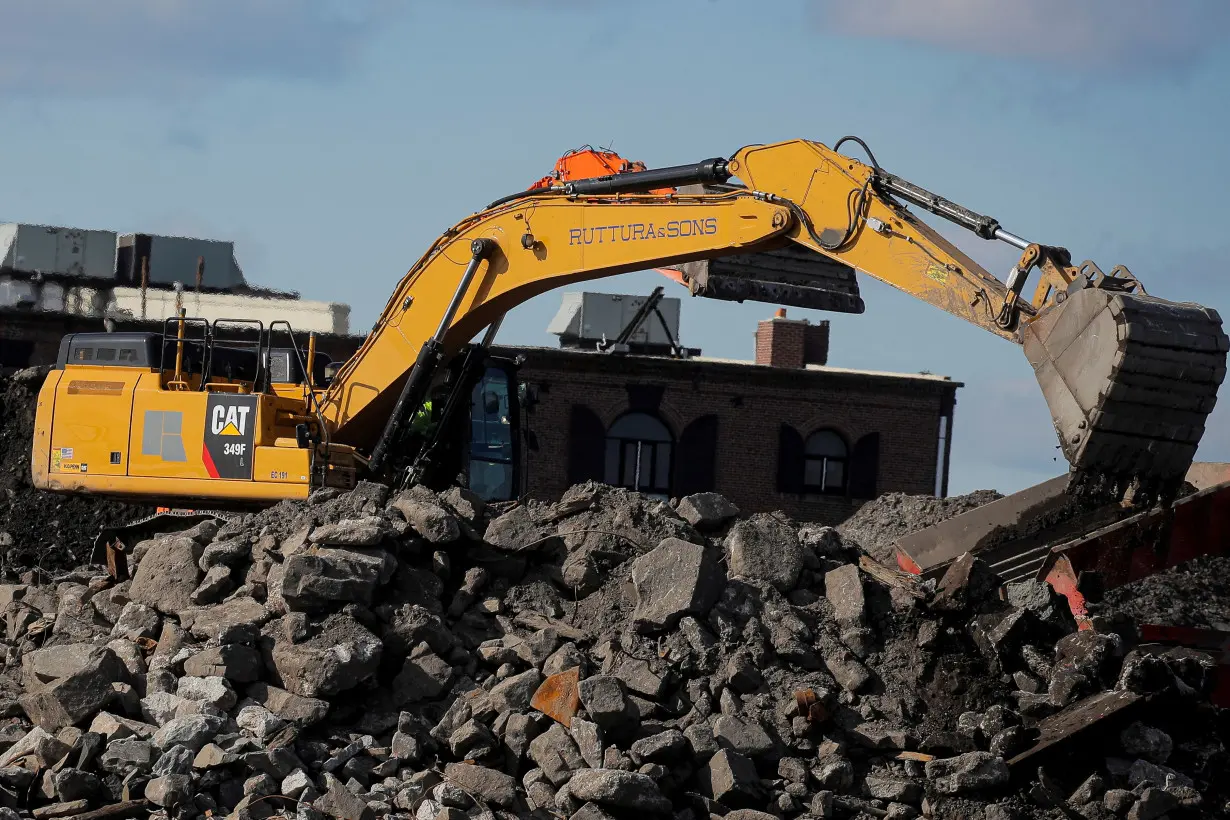 FILE PHOTO: A Caterpillar (Cat) Excavator is seen working at a construction site near the New York Harbor in Brooklyn, New York