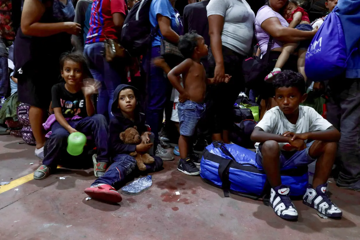 Migrants from southern Mexico's dispersed caravan pin hopes on permits