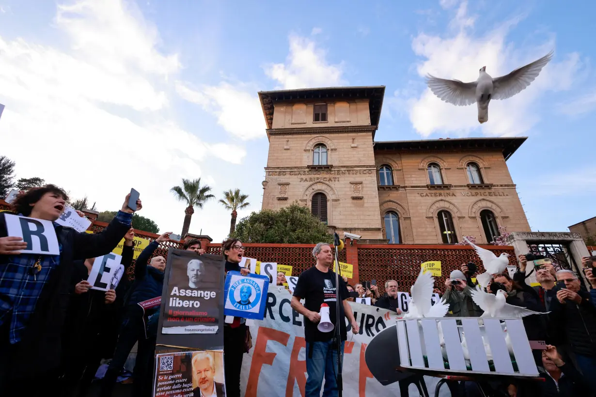 Julian Assange's supporters demonstrate in front of the British Embassy in Rome