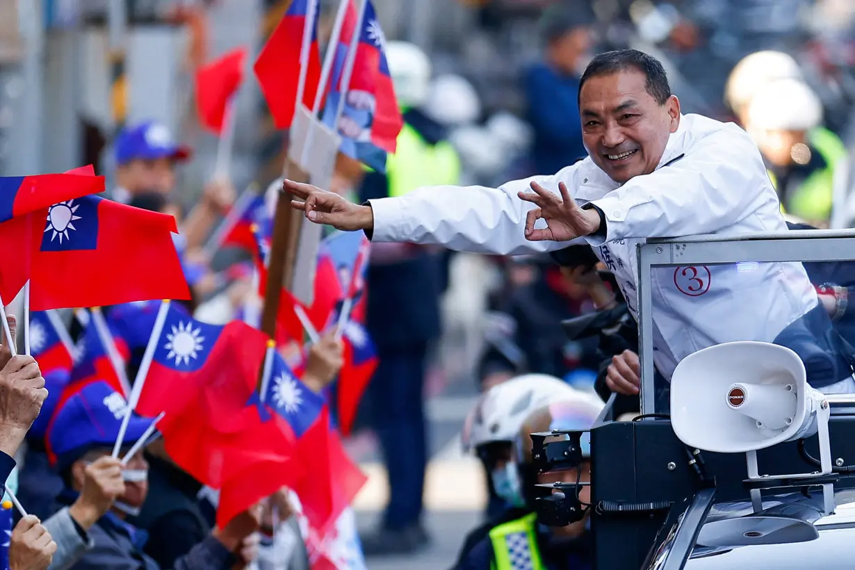 Hou Yu-ih, a candidate for Taiwan's presidency from the main opposition party Kuomintang (KMT), gestures to his supporters