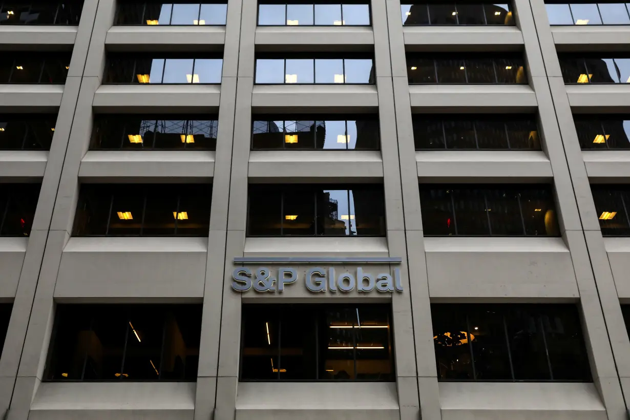 FILE PHOTO: The S&P Global logo is displayed on its offices in the financial district in New York