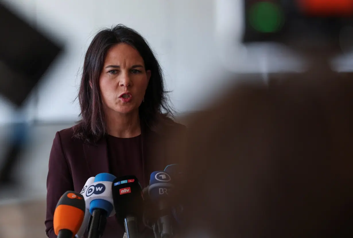 German Foreign Minister Annalena Baerbock delivers a statement at Ben Gurion International Airport in Lod