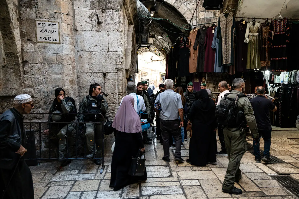 Israeli Border Police check Palestinians before Friday prayers inside Jerusalem's Old City