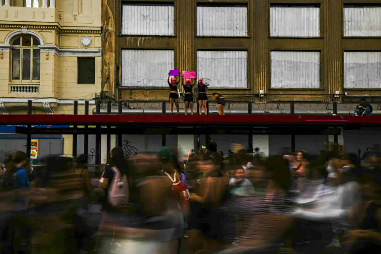 Facing historic shifts, Latin American women bathe streets in purple on International Women's Day