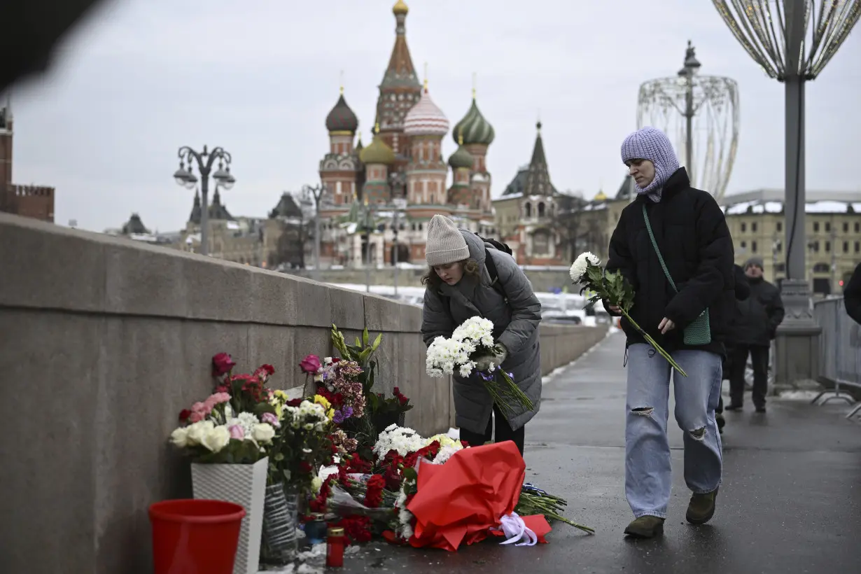 A Russian court sentences the co-chair of a Nobel-winning rights group to 30 months in prison