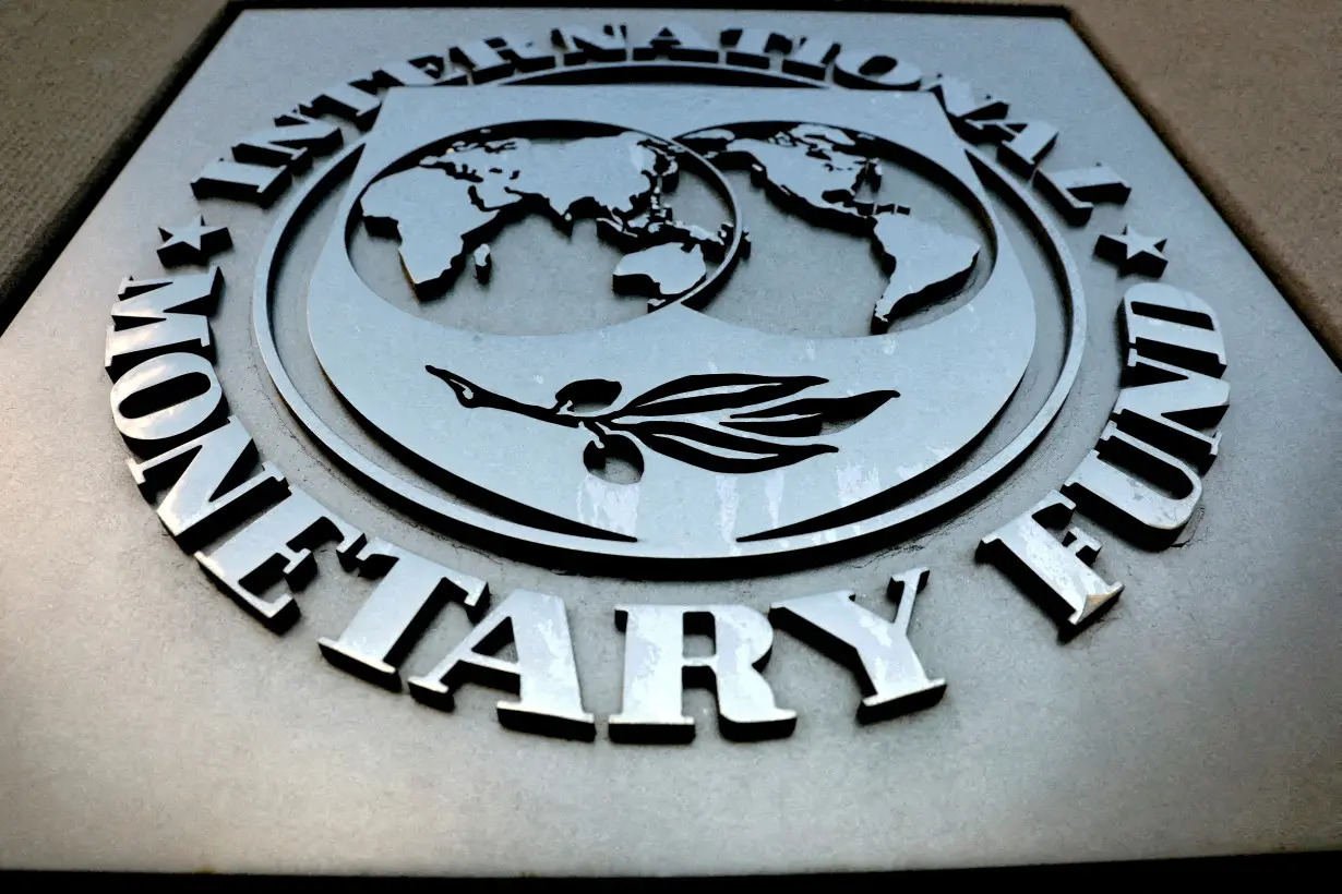 FILE PHOTO: The IMF logo is seen outside the headquarters building in Washington