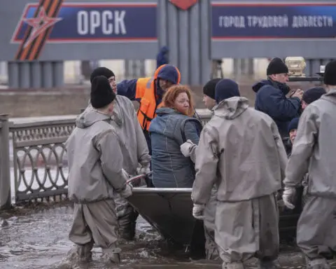 Russians stage a rare protest after a dam bursts and homes flood near the Kazakh border