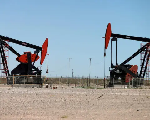 Oil settles lower as U.S. business activity cools, concerns over Middle East ease