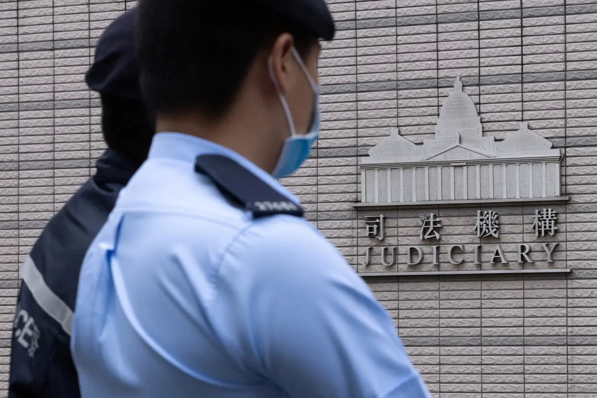 Police stands guard outside the West Kowloon Magistrates' courts in Hong Kong