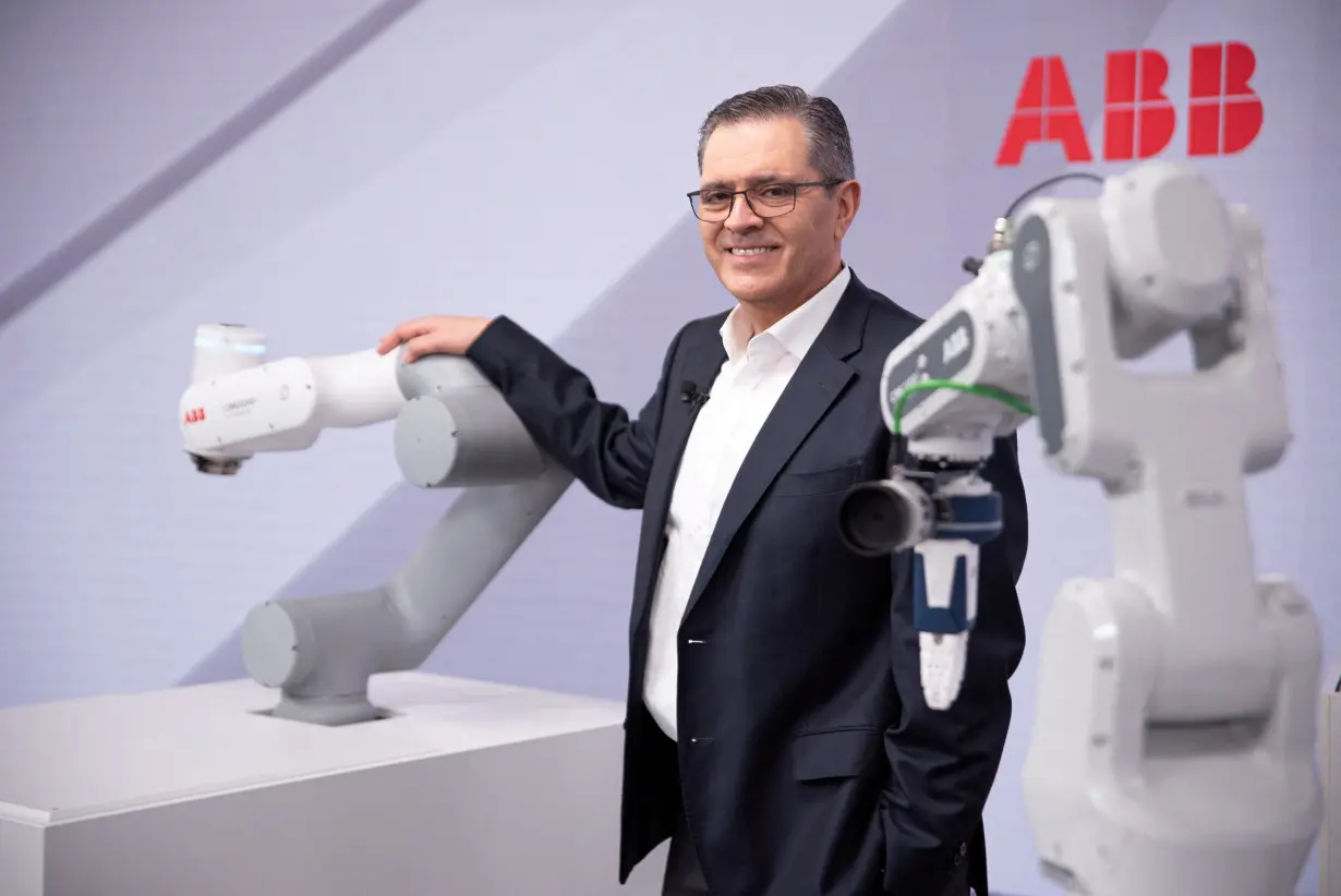 FILE PHOTO: Head of ABB Robotics and Discrete Automation business Sami Atiya poses next to robots in Zurich